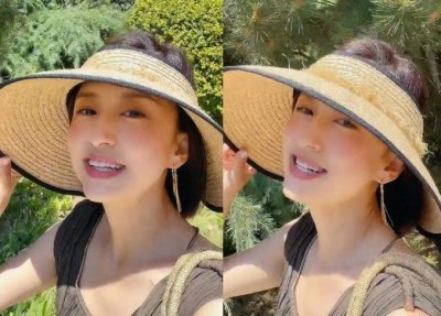 ​央视主持人张蕾参观花市，戴着草帽化着精致妆容，引起网友热议